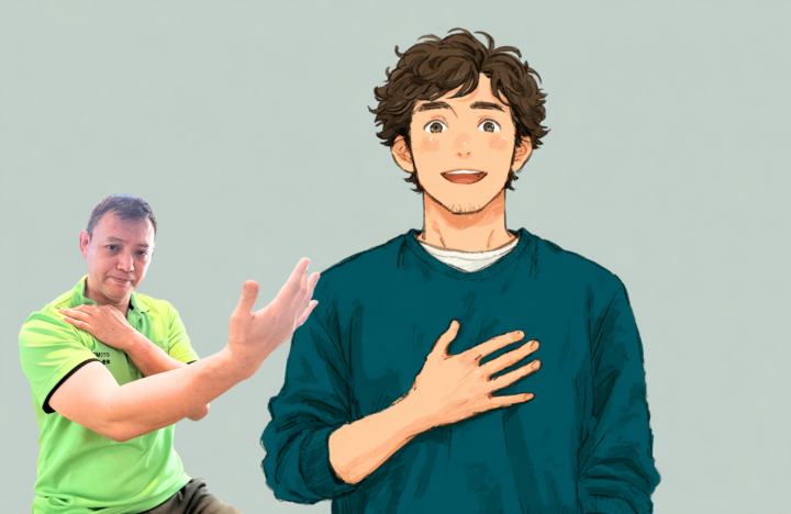 右手をあげている男性