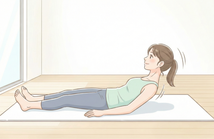 仰向けで起きる動作をしている３０代の女性